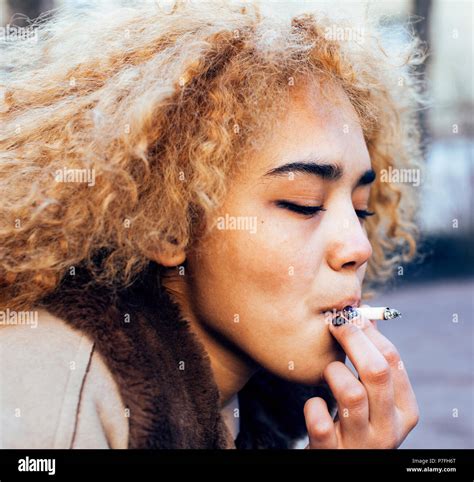 Teenage Girl Smoking Cigarette Outside Hi Res Stock Photography And