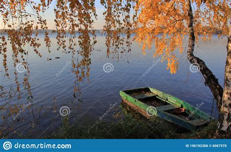 Picturesque Colorful Autumn Landscape With A Boat On The Lake Stock