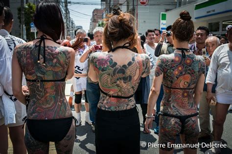 yakuza wives show their traditional tattoo during the sanja matsuri in asakusa photo pierre