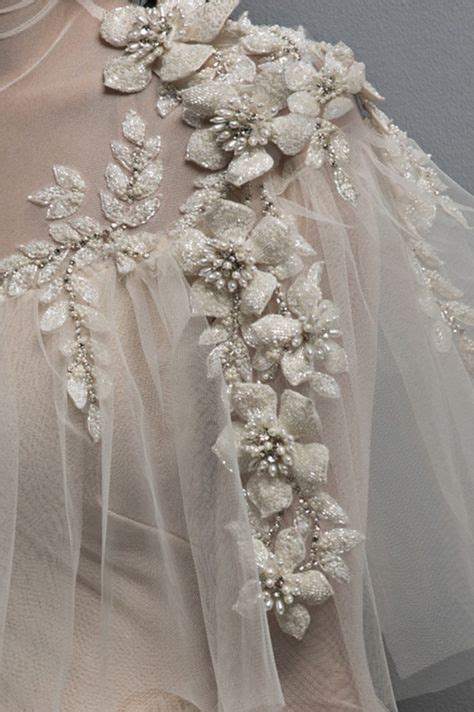 Ivory Tulle Ball Gown With Puff Flower Appliques And Hand Embroidery
