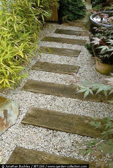 While one or two layers of sleepers is more than enough to divide your flower beds and. Railway sleeper and gravel path. this is an alternative idea to the paving in between the house ...