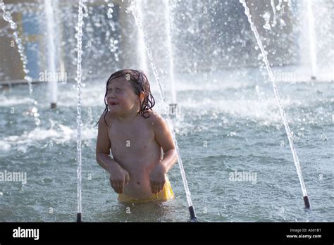 Little Girl In A Fountain Stock Photo Alamy