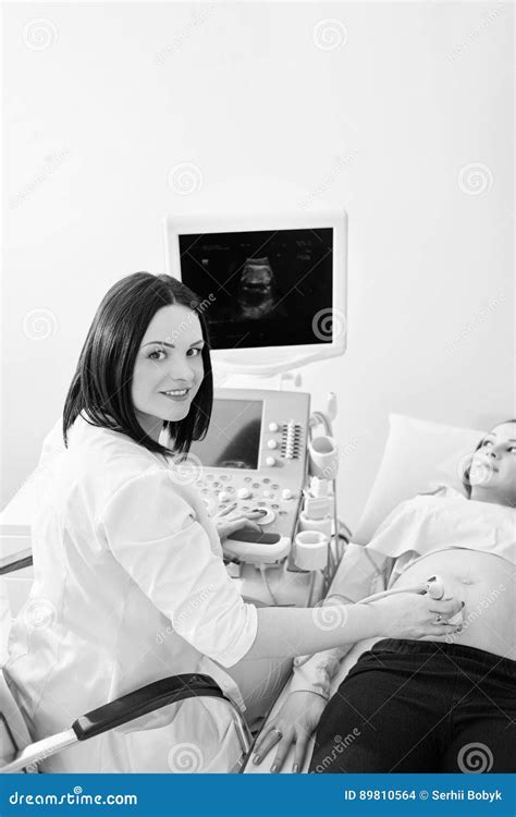 Pregnant Woman Having Ultrasonic Scanning At The Clinic Stock Photo
