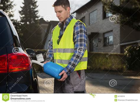 Metal nesco gas can, with the perfect chippy paint. Man Pouring Fuel Into Gas Tank Of His Car From Blue Gas ...