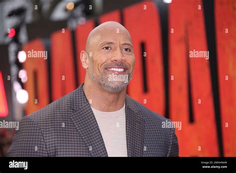 Actor Dwayne Johnson Poses For Photographers Upon Arrival At The