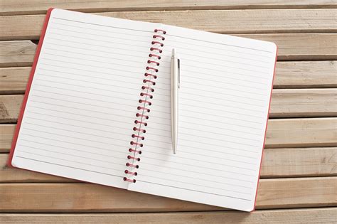 Free Image Of Open Blank Notebook With Pen On Wooden Table Freebie