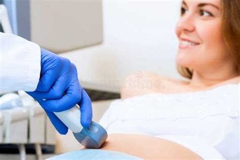 Close Up Of Hands And Abdominal Ultrasound Scanner Stock Image Image
