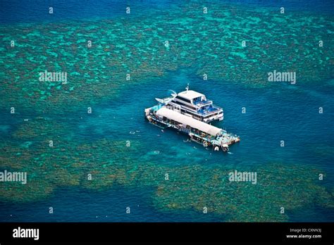 Aerial View Of A Tour Boat Docked At A Pontoon At The Great Barrier
