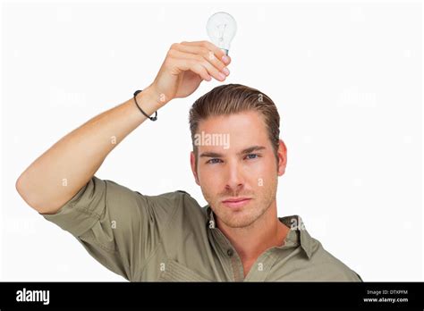 Man Holding Light Bulb Above His Head Stock Photo Alamy
