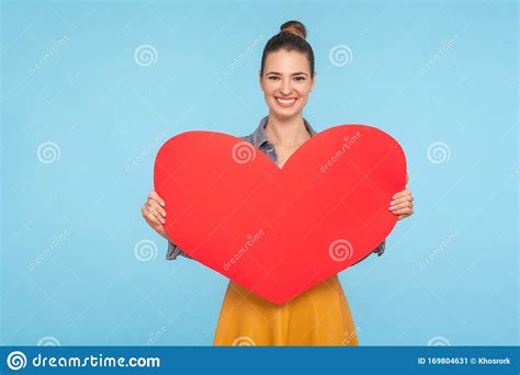Portrait Of Cute Happy Attractive Woman With Amiable Smile Holding Big