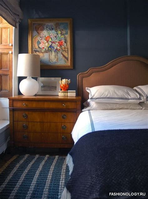 Breaking up the two tones allows for each to shine on their own in the space. Navy Blue Bedrooms With Pops of Orange | By Design Fixation