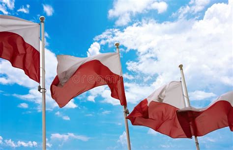 Polish Independence Day Four Polish Flags On A Blue Sky Stock Photo