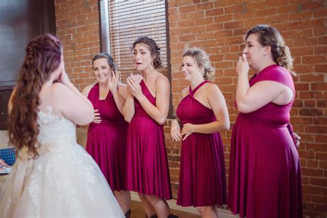 Bridesmaids Seeing The Bride For The First Time In Her Wedding Dress