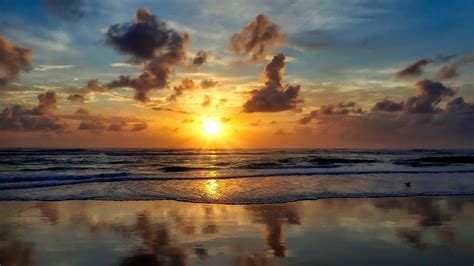 Download Wallpaper 1366x768 Sea Beach Sunset Sun Waves Tablet