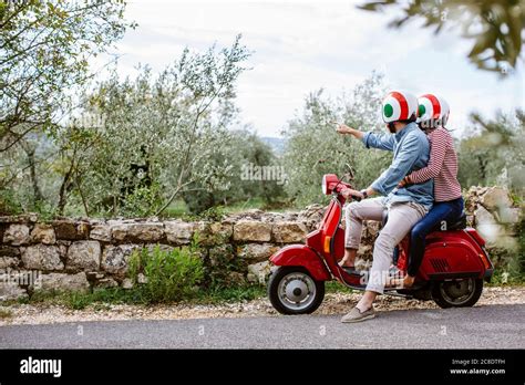 Young Couple Exploring Tuscany On Vespa Italy Stock Photo Alamy