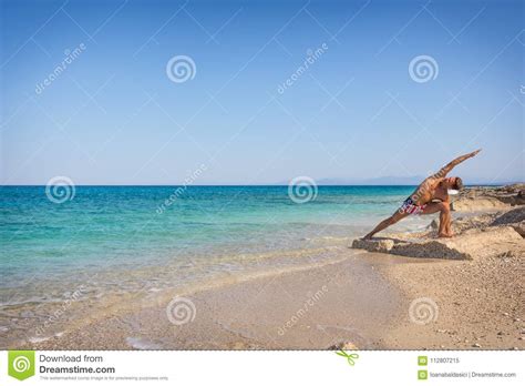 Adult Man On The Beach Practicing Yoga In Greece Stock Image Image Of