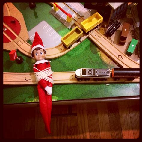 The Elf Is Playing With His Toy Train Set