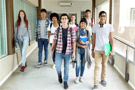 Students Walking In School Corridor Stock Photo Dissolve