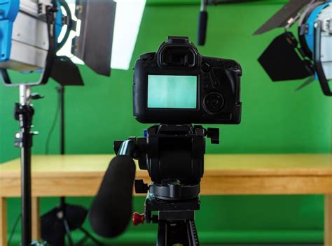Premium Photo Filming Set Up With A Camera Lights And A Green Screen