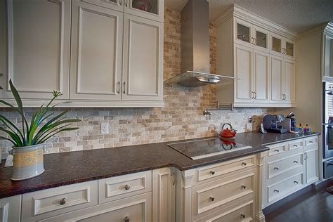 The area behind your stove tends to get the dirtiest, so it's a great space fill with a beautiful (and easily washable) tile. Natural Stone Kitchen Backsplash | Ceramic Decor