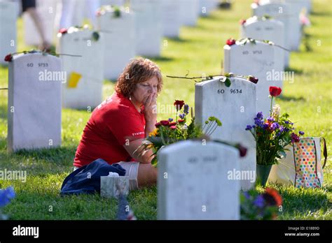 Washington, DC, USA. 26th May, 2014. Kathy Sayne mourns for her son who