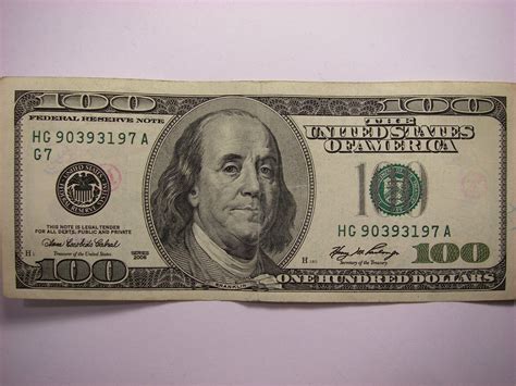 3d illustration of 100 dollar bills placed in bundles in a large bank depository. $100 Dollar Bill with Chopmarks (the little stamps of ...
