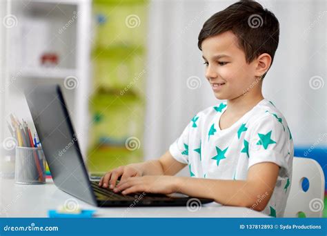 Student Boy Typing On Laptop Computer At Home Stock Image Image Of