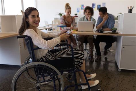Disabled Female Smiling At The Camera In The Office Stock Image Image