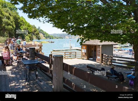 Visitors Gather At The Lake Chabot Marina And Sit On Small Tables On