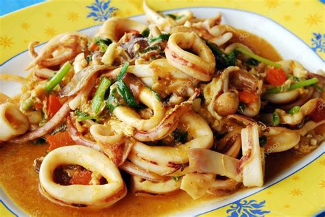 Hot and spicy thai country style red curry (without coconut milk) with green beans, bamboo, and herbs (medium or hot) and your choice of meat. Thai Food Spicy Squid Curry — Stock Photo © kritiya #10257849