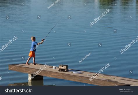 Young Boy Fishing Off Dock Stock Photo 658897213 Shutterstock