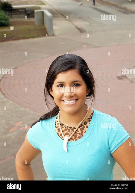Young Latina Girl Outdoors In Blue Top Smiling Stock Photo Alamy