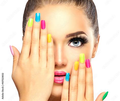 Beauty Girl Face With Colorful Nail Polish Manicure And Makeup Stock