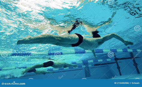 Male Swimmers Training Session Captured In An Underwater View