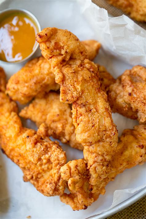 If you're looking for the secret to tender fried chicken, marinate the chicken in spiced buttermilk before you fry it. Fried Chicken Tenders With Buttermilk Secret Recipe : Fried Chicken Tenders The Seasoned Mom ...