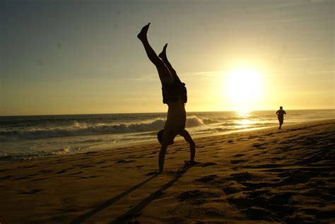 Free Images Man Beach Sea Coast Sand Ocean Horizon Sun Sunrise Sunset Sport