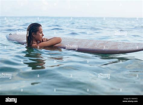 Woman Surfing Board High Resolution Stock Photography And Images Alamy