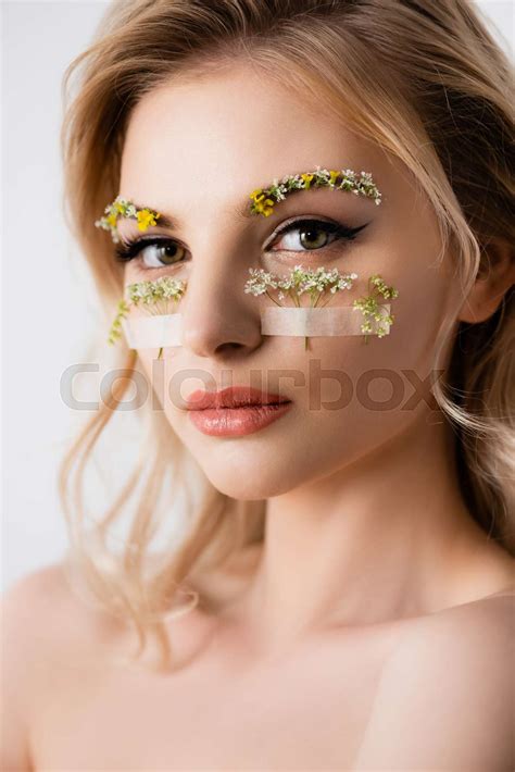 Naked Beautiful Blonde Woman With Wildflowers Under Eyes Isolated On