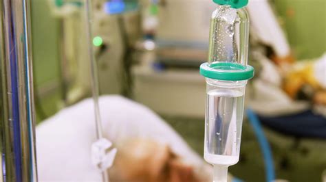 Intravenous Drip In Icu With Patient On Background Stock Video Footage 00 13 Sbv 301158534