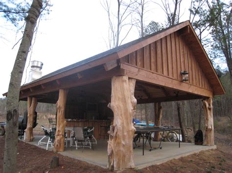 It is an outdoor structure that consists of a roof and open sides. Rustic Cedar Log pavilion - Traditional - Patio ...