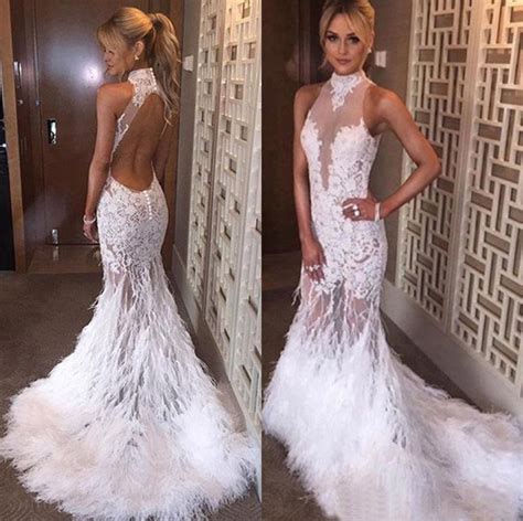 A beautiful detail on the side along with a side skirt slit that makes you feel confident while showing off your beautiful legs and heels. Sexy Mermaid High Neck Backless Lace Feather White Prom ...