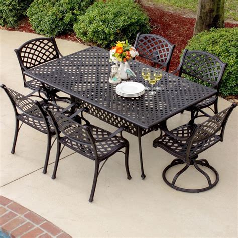 Heritage Piece Cast Aluminum Patio Dining Set With Swivel Rockers And Rectangular Table By