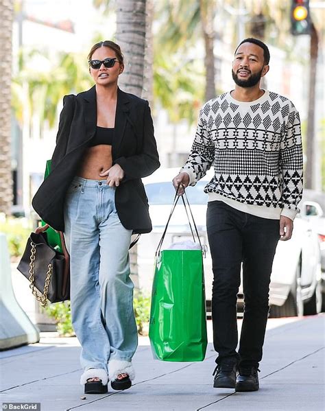 Chrissy Teigen Shows Off Abs In Tiny Crop Top Jeans And A Blazer While