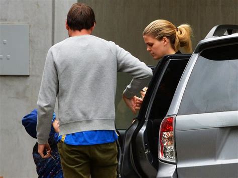 Belle gibson has stopped to remove her glasses and wipe away tears. Belle Gibson's mum Natalie slams story