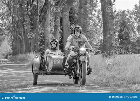 Cheerfull Couple Having A Ride On A Vintage Motorcycle With Side Car
