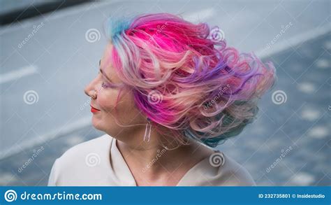 Close Up Portrait Of Curly Caucasian Woman With Multi Colored Hair