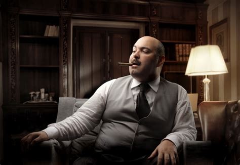 Premium Photo Rich Fat Man Smoking A Cigar
