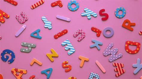 Colorful Magnetic Plastic And Paper Alphabet Letters Placed Randomly