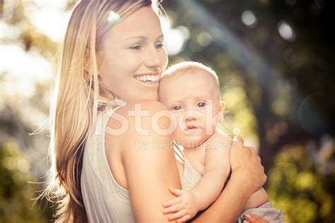 Smiling Mother And Baby In Park Stock Photo Royalty Free Freeimages