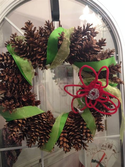 Pinecone wreath on my front door | Wreaths, Pinecone wreath, Christmas wreaths
